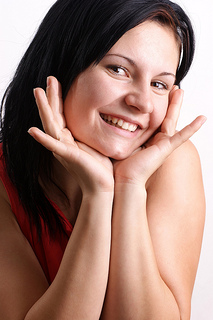 Woman smiling, after having braces